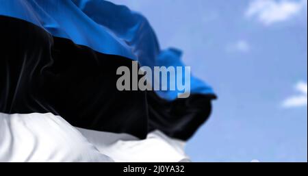 Detail of the national flag of Estonia waving in the wind on a clear ...