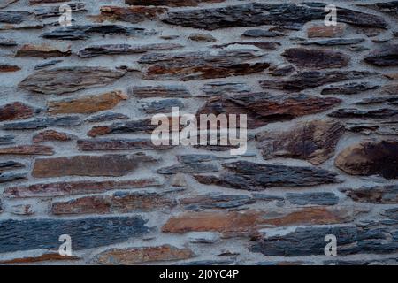 Texture of stone wall with cement. Stone backgrounds with gray cement. Stock Photo