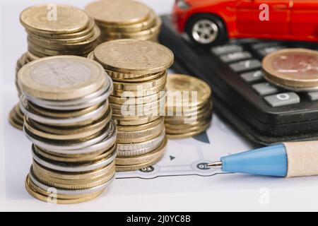 Stacked coins pen calculator. High quality photo Stock Photo