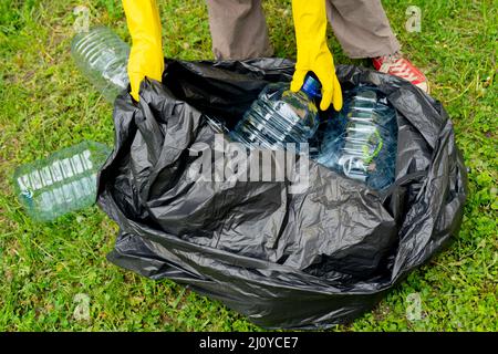 Yellow bags full of plastic waste Stock Photo - Alamy