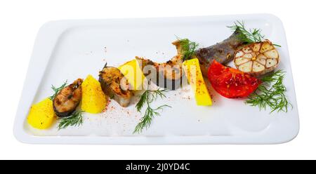 Deliciously baked rainbow trout steaks with potatoes on white plate Stock Photo