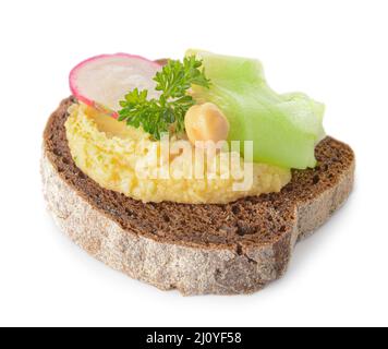 Piece of bread with tasty hummus on white background Stock Photo