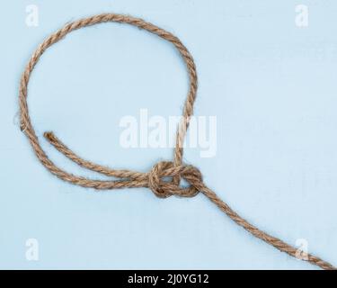 Twine strong beige rope simple knot. High quality photo Stock Photo