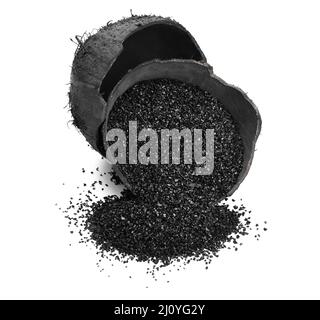 Coconut shells with activated carbon on white background Stock Photo