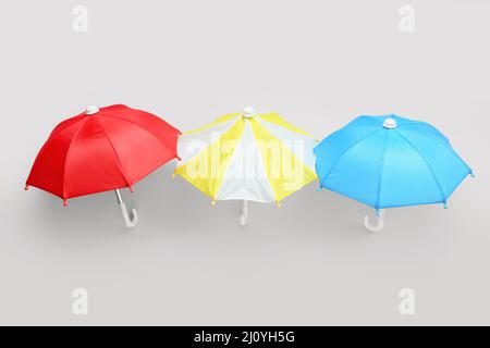 Different umbrellas on white background Stock Photo