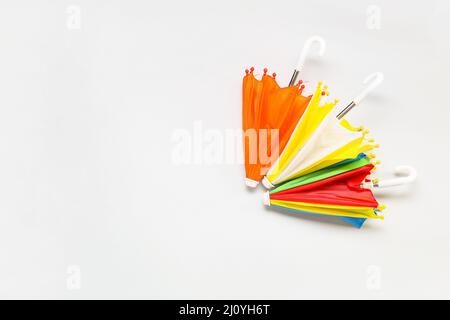 Different umbrellas on white background Stock Photo