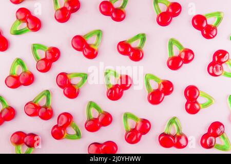 Sweet jelly cherry candies pink surface. High quality photo Stock Photo