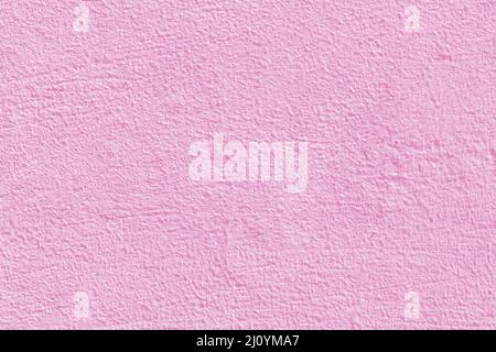 Pink stucco texture. Designer interior background. Abstract architectural surface. Stock Photo