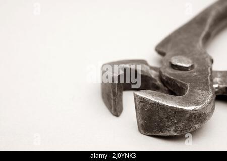 Tools for pulling nails - old metal pliers. Stock Photo