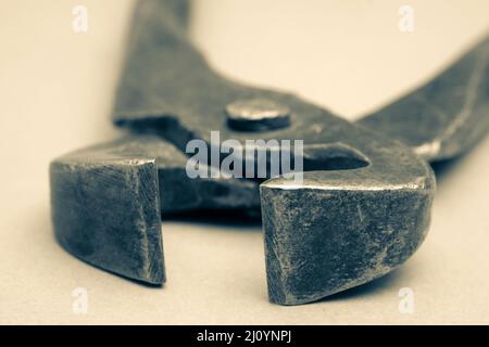 Tools for pulling nails - old metal pliers. Stock Photo