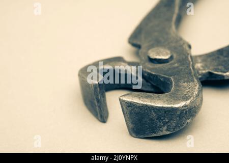 Tools for pulling nails - old metal pliers. Stock Photo