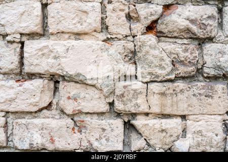 White and beige paint on the wall of a house. Construction and repair. Stock Photo