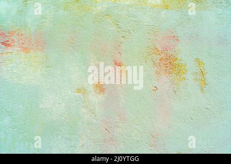 Light green stucco. Rough wall of an old house. Abstract building background. Stock Photo