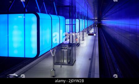Subway station with blue lights at University on the Speicherstadt area in Hamburg Stock Photo