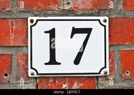 White house number plaque, showing the number seventeen Stock Photo