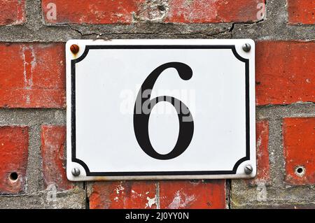 White house number plaque, showing the number six Stock Photo