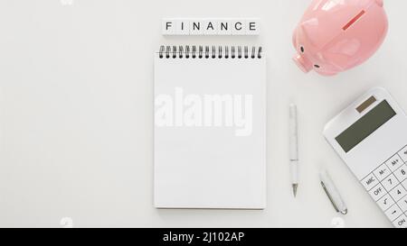 Financial elements arrangement with empty notepad Stock Photo