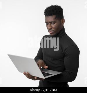 Focused man using laptop Stock Photo