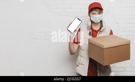 Medium shot guy holding box phone Stock Photo