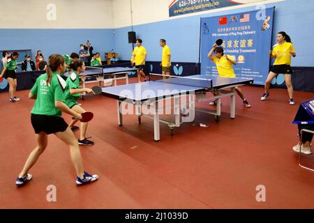 Los Angeles, USA. 21st Mar, 2022. Players participate in a Ping-Pong friendship tournament in Los Angeles, the United States, March 20, 2022. A table tennis friendship match was held here on Sunday to celebrate the 50th anniversary of 'Ping-Pong diplomacy' between China and the United States. The commemorative event was jointly organized by the USA Table Tennis (USATT) and the All American Chinese Association. Credit: Xinhua/Alamy Live News Stock Photo