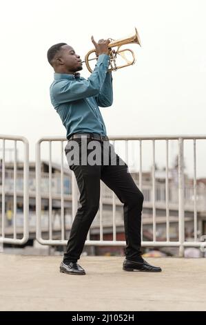 Young man playing music jazz day Stock Photo