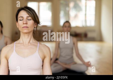 Yoga teacher class teaching attendants 3 Stock Photo