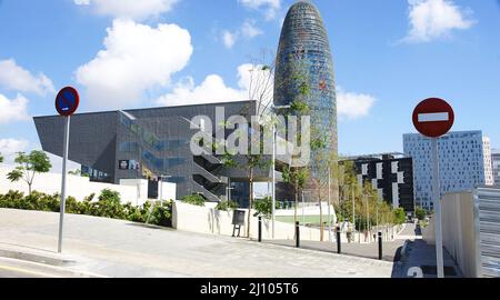 Facade of the Museu del Disseny and the Agbar tower with pond in Barcelona, Catalunya, Spain, Europe Stock Photo