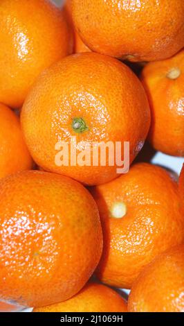 Tangerine on a white background and with a label in a European language Stock Photo