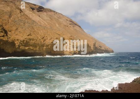 Sea cliff in the Entradero de Machin. Montana Clara. Integral Natural Reserve of Los Islotes. Canary Islands. Spain. Stock Photo