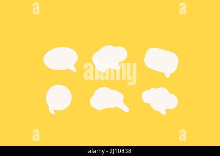 Blank white speech bubbles with copy space on a yellow background Stock Photo