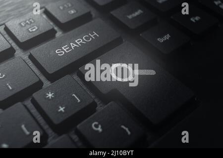 Keyboard with search button. Concept of searching browsing Internet data information. Stock Photo
