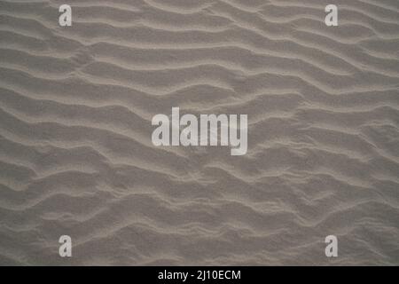 sand texture. wavy sand textured background. sand textured beach Stock Photo