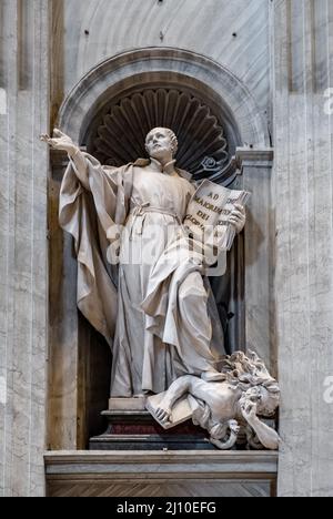 Rome, Italy - May 27, 2018: Founder statue of St. Ignatius of Loyola by Camillo and Giuseppe Rusconi at left nave of papal St. Peter's Basilica Stock Photo