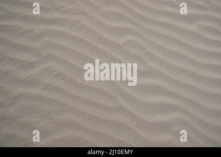 sand texture. wavy sand textured background. sand textured beach Stock Photo