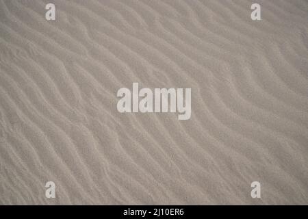 sand texture. wavy sand textured background. sand textured beach Stock Photo