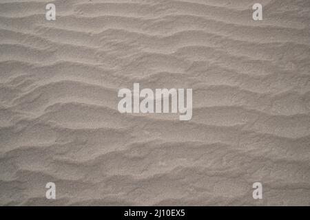 sand texture. wavy sand textured background. sand textured beach Stock Photo