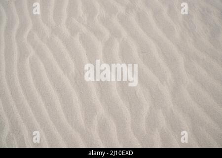 sand texture. wavy sand textured background. sand textured beach Stock Photo