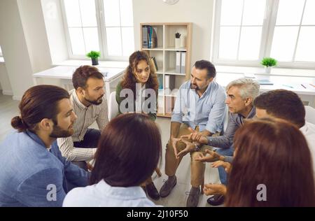 Group of business people having a discussion during a work meeting in the office Stock Photo