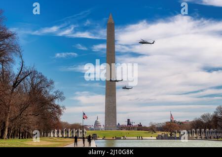 Helicopters in flight at the Washington Monument with US President, Washington, DC, USA Stock Photo