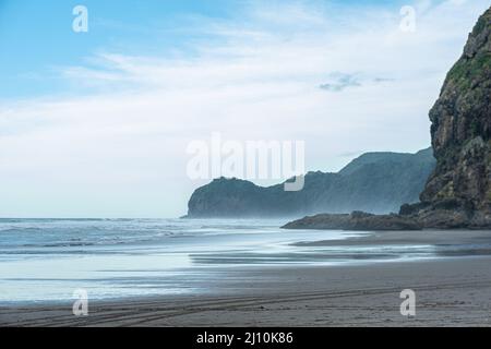 Photo of the beach near rocks and mountains Stock Photo