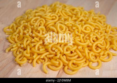 Noodles on a wooden plate Stock Photo