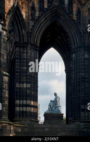 The stature of Sir Walter Scott sitting within the arch of the neoclassical Scott memorial in Edinburgh. Stock Photo