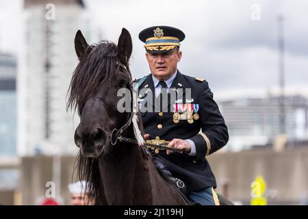 March 20, 2022, Lt. Col. Gerry Scott (ret) on black Fresian horse, Hercules, at South Boston St. Patrick's Day Parade. Stock Photo