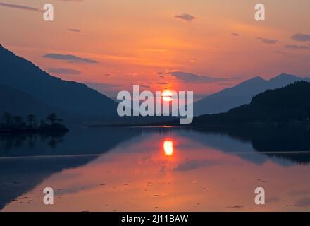 Loch Leven, Ballachulish, Scotland, UK. 21st March 2022. Sunset on Loch Leven looking towards the Ballachulish bridge. Stock Photo