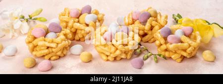 Springtime sweet nests filled with Easter eggs Stock Photo