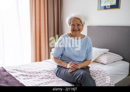 Portrait of smiling senior woman at home Stock Photo