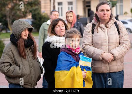 Batumi, Georgia - March 21, 2022: girl with the flag of Ukraine on her shoulders Stock Photo