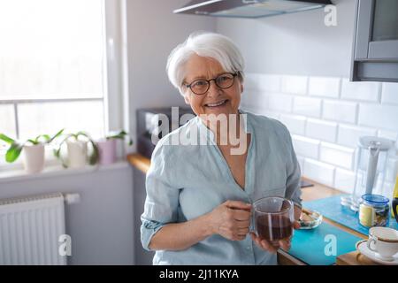 Portrait of smiling senior woman at home Stock Photo