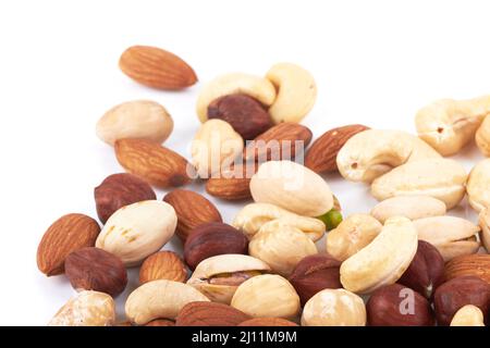 Heap of mixed nuts isolated on white background Stock Photo