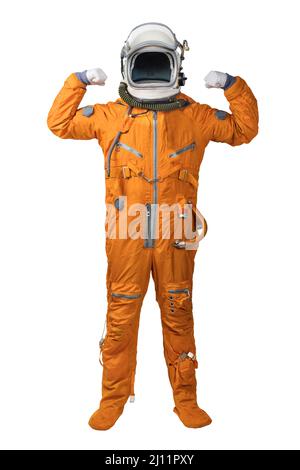 Astronaut wearing orange spacesuit and helmet showing biceps gesture isolated on white background Stock Photo